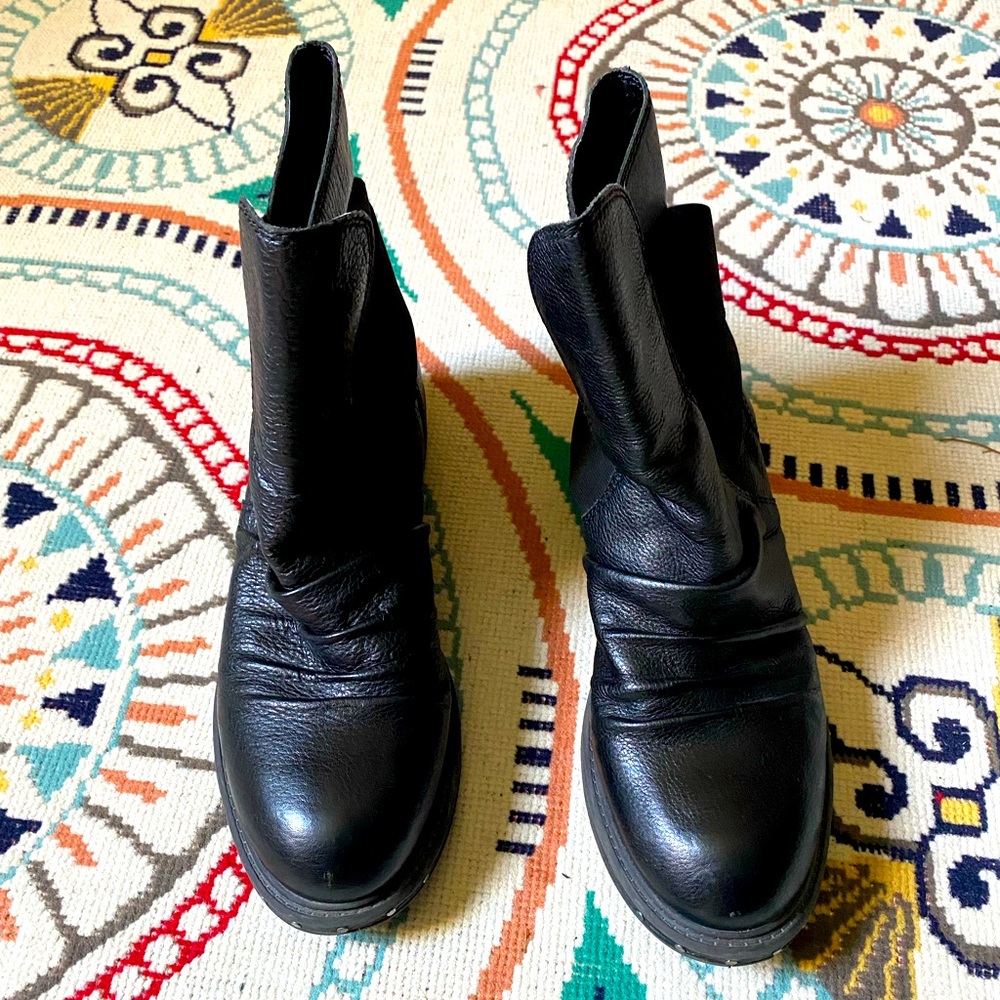 Black leather Naya Boots. Leather 8 inch shaft and synthetic rubber sole.